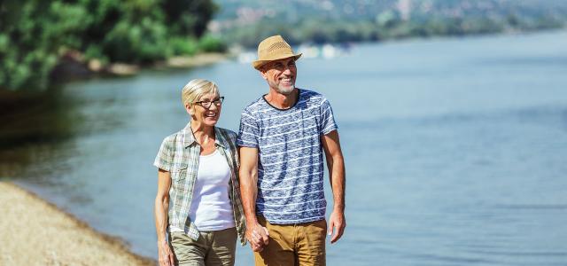 Senior Couple Relaxing Together by the Lakeshore